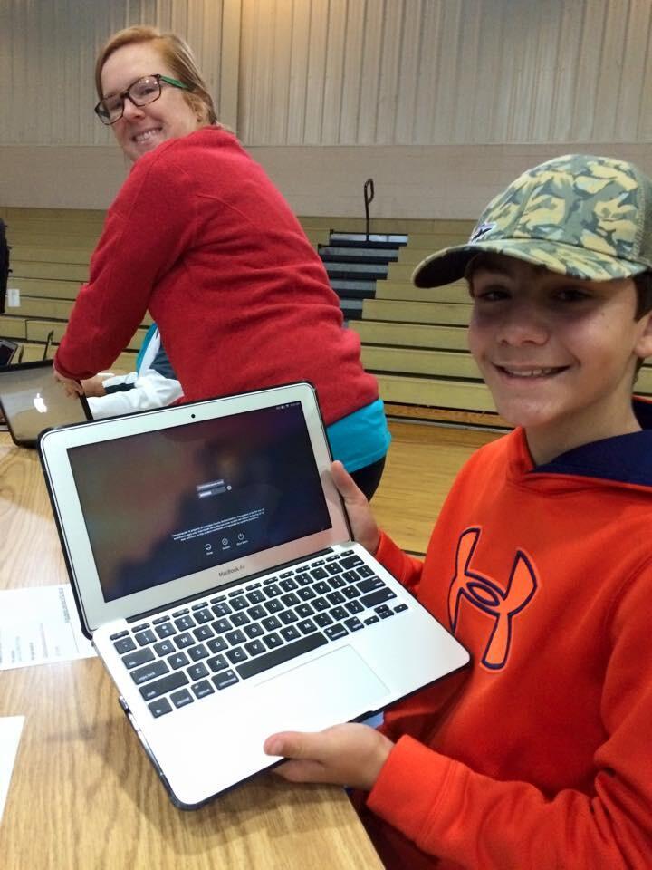 Student enjoying his new MacBooks in the rollout