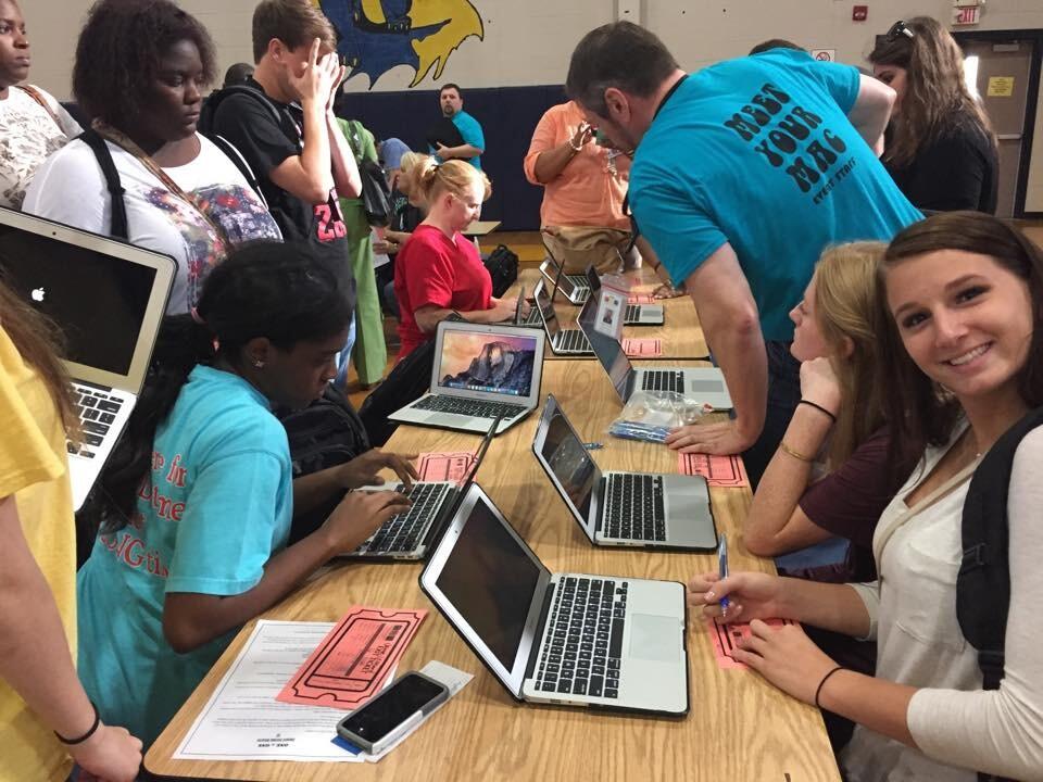 Students enjoying their new MacBooks in the rollout